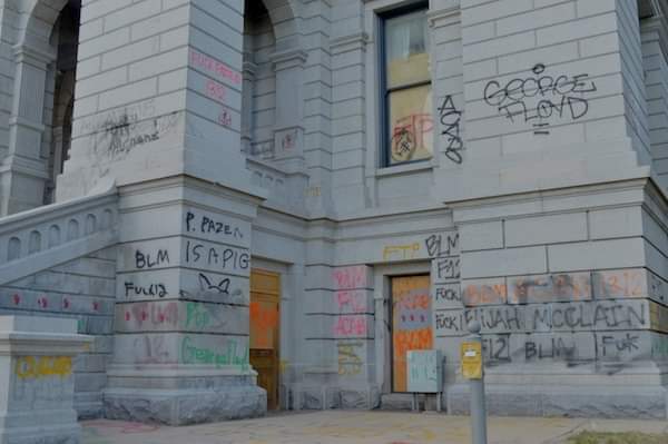 Graffiti capitol or festive tent city? Polis holds contest to redecorate driver’s license