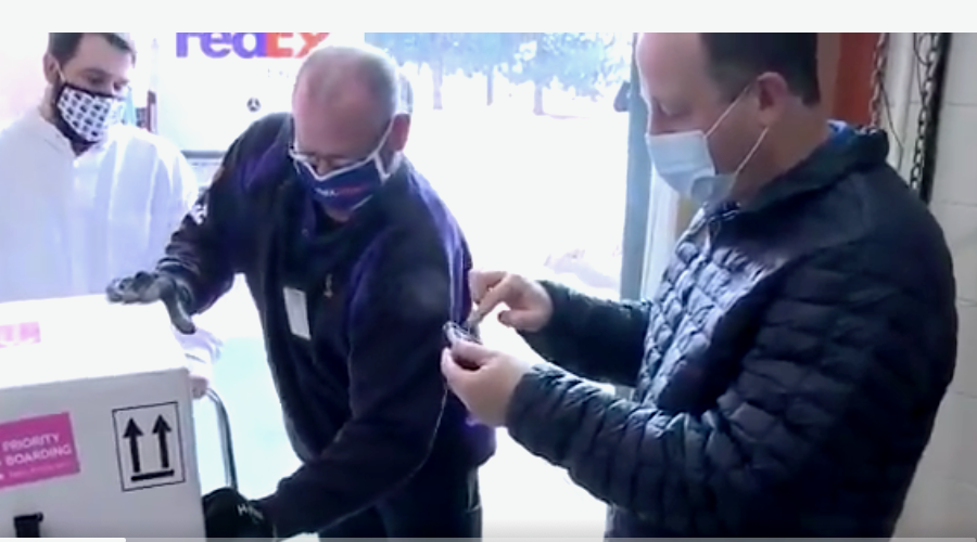 Is he COVID-free? Polis makes media appearance to welcome, help unpack vaccine