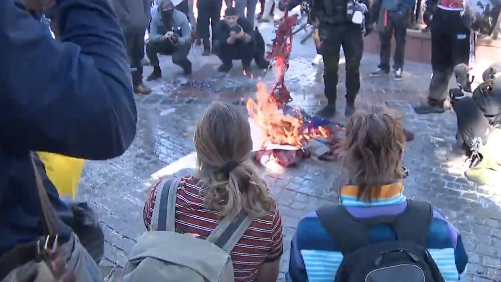Unity? Colorado leftists celebrate Biden’s inauguration by burning American flags