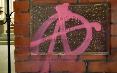 Protestors target and tag governor’s mansion, chant against Polis