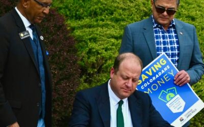 Polis signs law temporarily saving you 2 cents a gallon on gas until he’s reelected