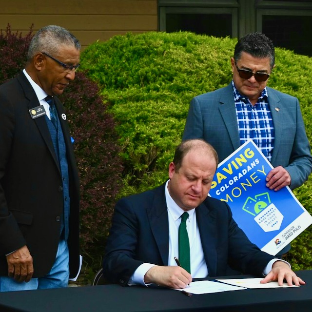 Polis signs law temporarily saving you 2 cents a gallon on gas until he’s reelected